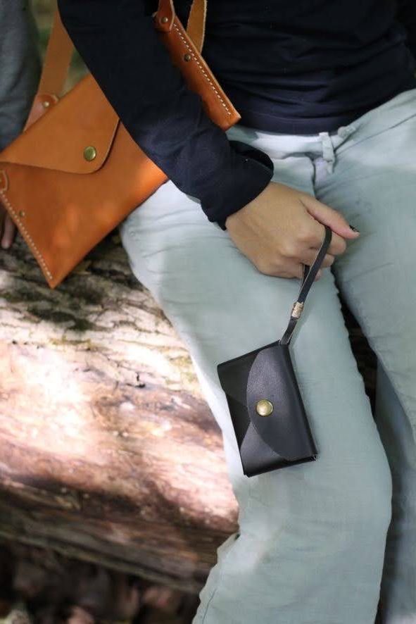 Treasure Pouch and Wanderlust in vegetable tanned leather, shown together.