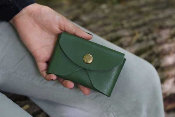 Upclose shot of a Treasure Pouch in green vegetable tanned leather.